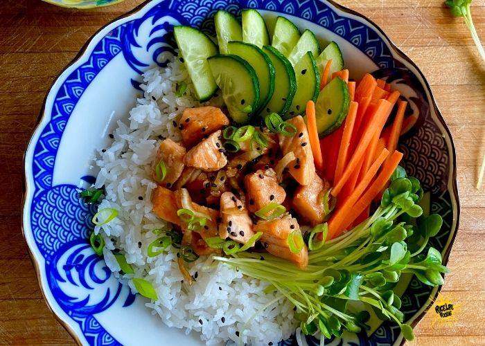 Delicious Cooked Salmon Poke Bowl with Custom Toppings